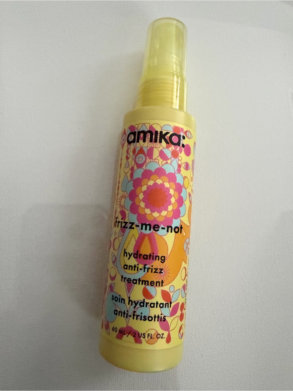 amika Hydrating Anti-Frizz Treatment Spray - Yellow with Multicolor Pattern